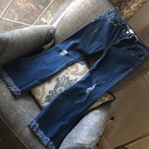 Flare crop jean with fringe hem